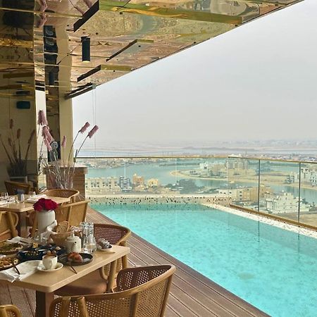 The House Hotel Al Khiran Bagian luar foto